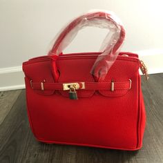 New Red Leather Women Handbag Never Used Red Tote Box Bag For Office, Red Luxury Bag With Adjustable Strap, Luxury Red Bag With Hasp Closure, Trendy Red Satchel For Office, Luxury Red Bag With Adjustable Strap, Luxury Red Box Bag For Everyday Use, Trendy Red Office Satchel, Trendy Red Shoulder Bag With Hasp Closure, Red Top Handle Box Bag For Office