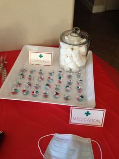 a red table topped with lots of medical supplies