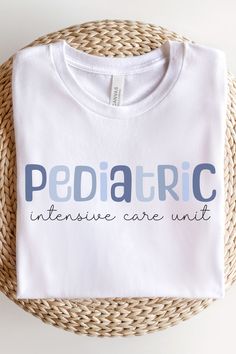 a white t - shirt with the words pediatric intensive care unit printed in blue on it