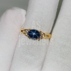 BAND- AS JEWELLERS GEMSTONE- 100% NATURAL STAR BLUE SAPPHIRE SAPPHIRE STONE SIZE -5X7MM SAPPHIRE WEIGHT - 1.90CT STONE SHAPE- OVAL GEM COLOUR - BLUE SECONDARY STONE - Natural DIAMOND PLEASE GIVE YOUR OPENION OR FEEDBACK ABOUT THE PRODUCT. WE ACCEPT BULK ORDER ALSO. THANK YOU Colorful Sapphire Ring, Starburst Sapphire Ring, Star Saphire Ring, Gold Sapphire Ring Star, Blue Star Ring, Sapphire Pearl Ring, Dainty Sapphire Ring, Star-shaped Sapphire Rings For Anniversary, Star Shaped Sapphire Jewelry For Anniversary