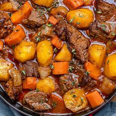 beef stew with carrots and potatoes in a bowl