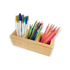 several pencils in a wooden holder on a white background