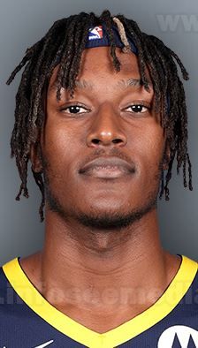 a basketball player with dreadlocks is shown in this undrecognized photo