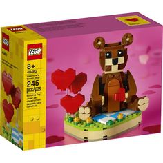 a lego box with a bear sitting on top of it