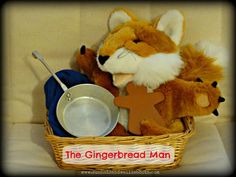 a stuffed animal sitting in a basket next to a metal pan with a cross on it