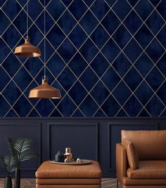 a living room with two chairs and a footstool in front of a blue wall