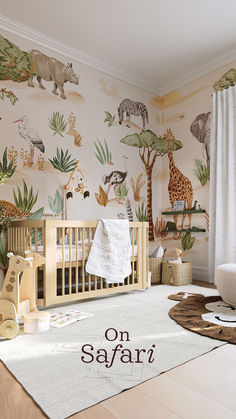 a baby's room with an animal themed wallpaper and crib in the corner