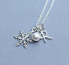 "This winter bridesmaid necklace, all in Sterling Silver, features an intricately detailed, snowflake, personalized script initial, and a 6mm Swarovski pearl in your choice of color.   This necklace comes at a standard 17\" length. If you'd like shorter or longer lengths for your necklaces (up to 22 inches at no additional cost), just put a note in at checkout. Please let me know what initial(s) and which necklace card(s) you would like at checkout.   I have cards saying \"Thank you for being my Winter Bridesmaid Gifts, Winter Wedding Jewelry, Winter Bridesmaid, Winter Bridal Jewelry, Pearl Bridesmaid Jewelry, Winter Bridesmaids, February Birthstone Necklace, Bridesmaid Necklace Gift, Bridesmaids Gift Sets