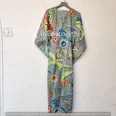 "This Beautiful Indian Cotton Caftan or can be called as Tunic is made with super fine quality cotton and designs have been crafted by Hand Prints. Measurements :- Size - Free Size Length -130 Cm /52\" Inches Bust/chest size - 120 CM/ 48\" Inches Fabric - 100% Cotton Pattern - Floral Kaftan has Adjustable Drawstring Waist to loose or tight , Kaftan has V Shape Neck Which is 8\" Inches Deep. Kaftan Is Multi-purposeand can be worn as a cover up at the Beach ,Loumge wear ,sleepwear ,Pregnant Women Fitted V-neck Kaftan For Vacation, Fitted Bohemian Kimono For Vacation, Fitted Beach Kimono With Kimono Sleeves, Tropical Green Kimono For Beach, Tropical Green Beach Kimono, Fitted Multicolor Kaftan With Kimono Sleeves, Fitted Bohemian Kaftan With Kimono Sleeves, Fitted Printed Kimono For The Beach, Fitted Kaftan For Beach In Summer