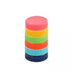 five different colored plastic cups stacked on top of each other