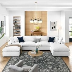 a living room filled with furniture and a large rug