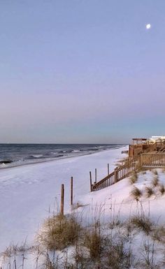 the beach is covered in snow and sand