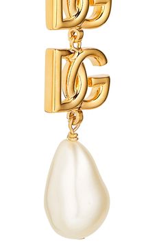 Bring Dolce&Gabbana's signature glamour to any look with these clip-on earrings flaunting goldtone logos and lustrous baroque imitation pearls. Clip-on style Nickel-free Hypoallergenic Goldtone plate/acrylic imitation pearl Made in Italy Luxury Gold Clip-on Earrings With Logo, Luxury Gold-tone Earrings With Logo Plaque, Elegant Gold Earrings With Logo Charm, Designer Gold Drop Clip-on Earrings, Elegant Yellow Gold Earrings With Gold-tone Logo, Luxury Gold Earrings With Logo Charm, Elegant Dangle Jewelry With Logo Charm, Luxury Gold-tone Clip-on Jewelry, Elegant Evening Jewelry With Logo Charm