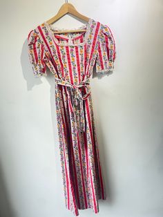 Pink Striped Floral Maxi Dress in excellent condition. 100% cotton. Literally the cutest print ever. Ties at the waist with removable belt and has lace details on collar and sleeves. Approximate measurements:Waist: 15"Length: 50" Floral Maxi, Floral Maxi Dress, Lace Detail, The Cutest, Maxi Dress, Collar, Lace, Floral, Pink