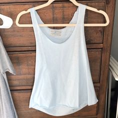 Never Worn Size Small Blue Summer Tank Top For Everyday Wear, Fitted Washed Blue Tank Top For Summer, Summer Washed Blue Top For Loungewear, Washed Blue Tops For Summer Loungewear, Light Blue Seamless Tank Top For Spring, Everyday Blue Sleeveless Tank Top, Light Wash Tops For Summer Loungewear, Casual Blue Sleeveless Tank Top, Blue Scoop Neck Tank Top For Spring