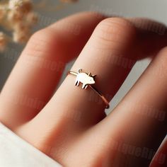 *Free engravings up to 20 characters* 🐷 Step into whimsical elegance with our delightful Gold Women's Pig Ring! 🌸 👑 Make a charming statement with this adorable piece, meticulously crafted with precision and passion. Designed for the modern woman who adores the sweetness and innocence of farm life. 🌿 🌟 Handcrafted from high-quality 10k gold, this dainty ring features a detailed pig design, capturing the playful and endearing nature of these beloved animals. 💫 💖 The pig symbolizes abundance, prosperity, and good fortune, making this ring a perfect accessory for those who seek joy and happiness in the simple pleasures of life. 🌼 🎁 Whether it's a treat for yourself or a cherished gift for someone special, this women's pig ring is sure to bring smiles and become a cherished addition t Whimsical Gold Wedding Rings, Cute Rose Gold Jewelry For Anniversary, Cute Gold Ring Jewelry, Cute Gold Rings For Gift, Adjustable Gold Whimsical Rings, Whimsical Adjustable Gold Rings, Animal Design Jewelry Gift, Whimsical Gold Ring Jewelry, Whimsical Gold Rings For Gift