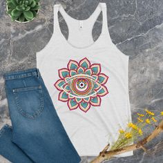 Introducing our vibrant Flower Mandala Tank Top, where spirituality meets style! 🌼👁️ 🌟 Embrace the mystical allure of the All Seeing Eye as it takes center stage on this stunning Mandala tank top. 🌼 Crafted with care, this Meditation Shirt is more than just apparel; it's a statement of your inner journey and a celebration of your unique style. Our Alternative Fashion piece is designed to bring positive vibes into your life, making it perfect for yoga sessions, meditation, or simply as Trippy Bohemian Summer Tops For Meditation, Fitted White Tops For Festival, Bohemian Graphic Print Tops For Music Festival, Hippie Printed Tops For Festivals, Bohemian Cotton Tops For Yoga, Multicolor Graphic Print Top For Festival, Artistic Graphic Print Tops For Festivals, Artistic Graphic Print Festival Tops, Bohemian Tops With Graphic Print For Festivals