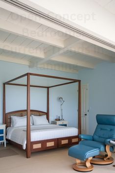 a bedroom with a blue chair and four poster bed in the middle of the room