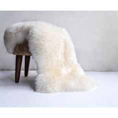 a chair with a white fur covering it