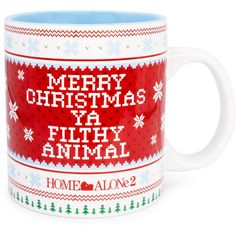 a coffee mug with the words merry christmas ya filthy animal on it's side