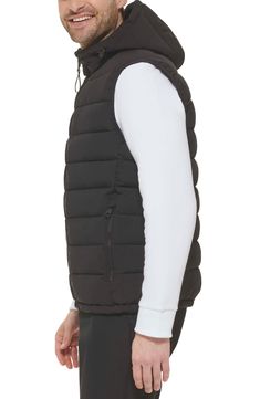 Easy to layer, this puffer-style vest features an attached hood that furthers the comfort. Attached hood Sleeveless 100% polyester Machine wash Imported Model stats: 6'1" height, 32" waist. Model is wearing size M. Hooded Puffer Vest, Puffer Style, Style Vest, Puffer Vest, Nordstrom Rack, Puffer, Calvin Klein, Nordstrom, How To Wear