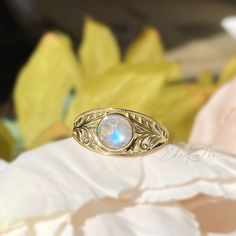 💍 Vintage style, Art Nouveau inspired Natural Rainbow Moonstone Filigree Engagement Band Ring  💍 Setting Detail ✔️Ring Size - US 4 to 9 contact us if you need any other sizes  ✔️Metal Purity- 10K Solid Gold ✔️Color:  Yellow or White ✔️Widest part of shank: 8mm 💎Center Stone Detail ✔️Stone: Moonstone ✔️Shape: Round Rose Cut Cabochon ✔️Size: approx.6mm Want to check out more rings?⬇️ https://etsy.me/2MyjnPw ❤️Follow us on Instagram @ elekalonjewelry for latest projects and designs.      If you have any questions, please feel free to message us. Intricate Design Moonstone Jewelry, Handmade Spiritual Filigree Ring, Oval Engraved Moonstone Ring For Wedding, Engraved Moonstone Round Ring For Weddings, Oval Moonstone Ring For Wedding With Intricate Design, Wedding Moonstone Ring Engraved Round Shape, Engraved Oval Moonstone Ring For Wedding, Oval Moonstone Wedding Ring With Intricate Design, Engraved Moonstone Wedding Ring