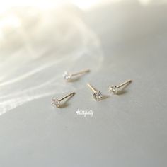 "14k solid Gold Studs, Dainty Earrings, Wedding Earrings, Gift For Her, CZ Earrings, Cute Earrings  -------DETAILS------- - \"Single\" - refers to 1 individual earring     \"Pair\" - refers to 2 earrings - Material: 14K solid gold - Stamped with Au585(14K) hallmark  - AAA Zircon - size: 4*4mm  ear nail length: 10mm width: 0.65mm - Free Beautifully wrapped & boxed -------PACKAGING------- We offer a free gift wrap option upon request. Just leave me a note at checkout saying that you would like your order gift wrapped. Each item is beautifully packaged in a letterbox friendly, hand stamped jewellery box made from 100% recycled card . -------MAINTENANCE------- Please store your accessories in a clean, dry environment. Avoid contact with cosmetics, perfumes, aerosols and moisturisers as they ma Tiny Minimalist Earrings For Wedding, Tiny Fine Jewelry Earrings For Wedding, Dainty Hypoallergenic Diamond Wedding Earrings, Minimalist 14k Gold Diamond Earrings For Wedding, Minimalist Yellow Gold Diamond Earrings For Wedding, Minimalist 14k Gold Diamond Wedding Earrings, 14k Gold Round Cut Earrings For Wedding, Dainty White Gold Bridal Earrings For Anniversary, Classic Tiny Earrings For Anniversary