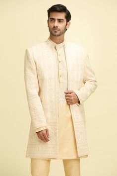 Beige full sleeves longline front open bundi with Gul bloom vine embroidery. Paired with a full sleeves embroidered yoke kurta and a pant. - Aza Fashions Long Sleeve Kurta With Naqshi For Reception, Long Sleeve Sherwani With Cutdana For Reception, Reception Sherwani With Cutdana And Long Sleeves, Traditional Fit Long Sleeve Sherwani With Chikankari Embroidery, Long Sleeve Kurta For Reception, Long Sleeve Traditional Wear For Reception And Transitional Season, Traditional Fit Sherwani With Resham Embroidery And Long Sleeve, Traditional Sherwani With Resham Embroidery And Long Sleeves, Traditional Fit Bandhgala With Zari Work And Long Sleeves