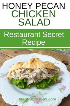 a chicken salad sandwich on a plate with the words honey pecan salad restaurant secret recipe