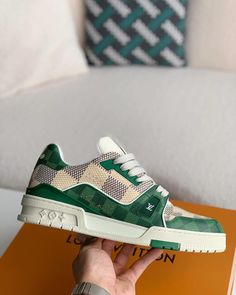 Embrace iconic style with a contemporary twist in these Louis Vuitton Trainer-inspired sneakers. The classic low-top silhouette is reimagined with a vibrant green and white colorway, featuring the signature Damier canvas for a touch of luxury. Crafted with meticulous attention to detail, these sneakers offer a premium look and feel, perfect for those seeking a statement piece that seamlessly blends streetwear edge with high-fashion inspiration. Luxury Classic Sneakers With Logo, Luxury Classic Sneakers With Embossed Logo, Luxury Custom Men's Sneakers With Leather Sole, Luxury Sneakers With Logo, Luxury Men's Sneakers With Logo, Luxury Urban Sneakers With Embossed Logo, Luxury Designer Sneakers With Logo Print, Luxury Men's Sneakers With Logo Patch, Luxury Designer Sneakers With Logo Patch