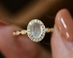 Untreated Crystal Ring For Anniversary, Untreated Crystal Anniversary Ring, Elegant Untreated Gemstones For Anniversary, Elegant Untreated Oval Opal Ring, Untreated White Wedding Rings, Elegant Chalcedony Opal Ring For Anniversary, Fine Chalcedony Jewelry For Wedding, Oval Chalcedony Moonstone Ring For Wedding, Untreated White Gold Jewelry For Wedding