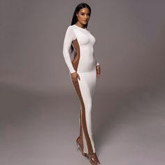 Features: Stay stylish and comfortable this autumn and winter with our Hollow Out Contrast Color Bodycon Maxi Dress for Women. With a new O neck design, long sleeves, and a sexy side split, you'll turn heads wherever you go. Made with high-quality materials, this dress is perfect for any occasion. White Long Sleeve Dress For Night Out, Chic Long Sleeve High Stretch Bodycon Dress, Chic High Stretch Long Sleeve Bodycon Dress, White Long Sleeve Bodycon Dress For Club, Long Sleeve Bodycon Dress With Side Slits For Evening, White Long Sleeve Bodycon Dress For Fall, White Long Sleeve Stretch Bodycon Dress, White Stretch Long Sleeve Bodycon Dress, Long Sleeve Bodycon Dress For Club