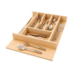 a wooden tray with utensils and spoons in it on a white background