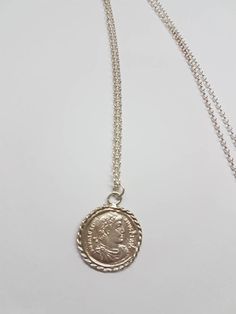 Long coin necklace, coin pendant necklace, silver coin necklace, silver pendant necklace medallion necklace, coin necklace, pendant necklace Ancient Greek coin, originally made of solid gold which was duplicated and wrapped with twisted gold wires rope to make a beautiful medallion pendant. I then casted it in sterling silver. The ancient coin is not a perfect circle in shape and a little rustic. The chain necklace is made in sterling silver. This long coin necklace is great for everyday wear, u Coin Necklace Silver, Pendant Necklace Long, Green Amethyst Earrings, Silver Coin Necklace, Ancient Greek Coin, Perfect Circle, Ancient Coin, Antique Coins, Coin Pendant Necklace