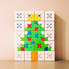 a colorful piece of art that looks like a christmas tree made out of legos