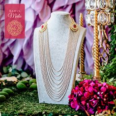 A stunning design, imbued with vintage glamour! Traditional mala with two kundan motifs on the sides and encrusted with kundan stones. Long dangling beaded chains are attached to the motifs. It works great for the grooms to pair with their sherwaanis. Approximate mala length is 13". Gold-plated on high-quality brass as base metal. Rahul Mala (Ruby) is in-stock & ready-to-ship. Delivery time frame for the Rahul Mala (Emerald) is 4-6 weeks. For custom or urgent requests, please contact support@ala Traditional Drape Wedding Jewelry With Latkans, Bollywood Style Necklace With Latkans For Wedding, Bollywood Style Necklaces With Latkans For Wedding, Bollywood Necklaces With Latkans For Wedding, Bollywood Style Wedding Necklaces With Latkans, Chandbali Bridal Necklace With Latkans For Rituals, Jeweled Kundan Necklace For Rituals, Bridal Chandbali Necklace With Latkans For Rituals, Elegant Mala For Rituals And Festivals