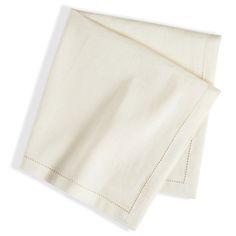 two white linen napkins folded on top of each other with stitching at the edges