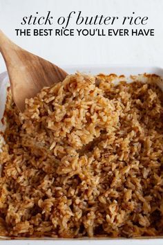 rice in a white dish with a wooden spoon on it and the words, stick of butter rice the best rice you'll ever have