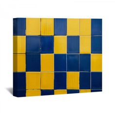 a blue and yellow tile wall with squares on the bottom, against a white background