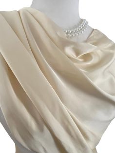 Satin Shawl Scarf Wrap. Satin Polyester feels like silk  This scarf is available in various colours, please check out there other listings r message me. This fasionable versatile shawl can be used to dress up an outfit for a special evening, a wedding or as a neck scarf. Effortlessly give a dress a new look by simply adding this shawl. Perfect as bridesmaid gifts or wedding favours, the perfect gift for any occasion. Mix and match with similar or contrast color jewelry, soaps, hand lotions or a box of chocolates and make the perfect personalized gift pack. Perfect as wedding coverup, bridesmaids gifts. Measures 20"Wx 74"L rectangular scarf.  The color is very close however is not exact. I have  tried to to capture the color as close as possible to its true color. If you are trying to match Elegant Silk Scarf With Satin Finish For Weddings, Elegant Cream Silk Scarf For Wedding, Cream Silk Shawl For Wedding, Elegant Cream Silk Shawl Scarf, Elegant Cream Silk Shawl, Elegant Silk Wraps For Wedding, Elegant Silk Wedding Wrap, Elegant Silk Wedding Wraps, Elegant Beige Wedding Wraps