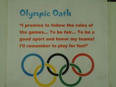 an olympic sign with the words olympics oath written in red, white and blue on it