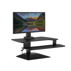 a computer monitor sitting on top of a black shelf