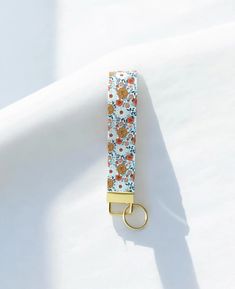 a keychain with a flower pattern on it