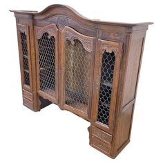 an old wooden sideboard with chicken wire on the doors and bottom shelf, isolated against a white background