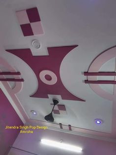 the ceiling is decorated in pink and white