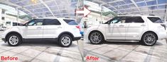 two white suvs parked side by side in front of a building with glass roof