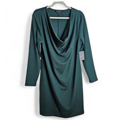 New With Tags Dress By Eloquii Flattering Cowl Deep V-Neckline Deep Green Color Long Sleeves 76% Polyester, 20% Viscose, 4% Spandex Size 14 In Excellent New Condition Approximate Flat-Lay Measurements: Pit To Pit 20" Waist 19" Length 38" Sleeves 24" Weight 1 Lb. 1.0 Oz. Green Cowl Neck Dress, Deep Green Color, Eloquii Dress, Cowl Neck Dress, Dress Plus Size, Deep Green, Cowl Neck, Flat Lay, Green Color