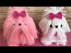 two pink and white dogs with bows on their heads