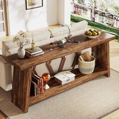 a living room with a couch, coffee table and bookshelf on the floor