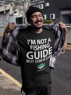 I'm not a fishing guide, but $100 is $100. Have some fun with this tshirt. Remember, you're just one cast away. Link to women's tshirt. - https://www.etsy.com/listing/1104203440 Link to YouTube FishOutLoud - https://bit.ly/YouTubeFOLa Please Note: We do not charge shipping EVER and we offer the highest quality, highest customer review shirts anywhere. This classic unisex jersey short sleeve tee fits like a well-loved favorite. Soft cotton and quality print make users fall in love with it over and over again. These t-shirts have-ribbed knit collars to bolster shaping. The shoulders have taping for better fit over time. Dual side seams hold the garment's shape for longer.  .: 100% Airlume combed and ringspun cotton (fiber content may vary for different colors) .: Light fabric (4.2 oz/yd² (14 Mens Fishing Shirts, Fishing Guide, Fun Shirt, Men Gifts, Cheap Shirts, Fishing Shirts, Outdoor Fun, Unisex Shorts, Cool Shirts